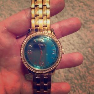 Woman’s gold Fossil watch